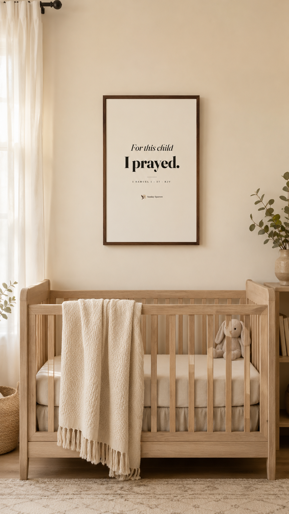 For This Child I Prayed — oak-framed print centered above a crib with a knit blanket