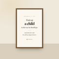 Train Up A Child (Proverbs 22:6) — King James scripture art print in a oak finish wood frame, hanging on a wall