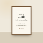 Train Up A Child (Proverbs 22:6) — King James scripture art print in a oak finish wood frame, hanging on a wall