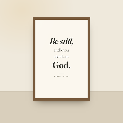 Be Still (Psalm 46:10), King James scripture art print in an oak finish wood frame, hanging on a wall