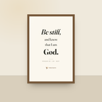 Be Still (Psalm 46:10) — King James scripture art print in a oak finish wood frame, hanging on a wall