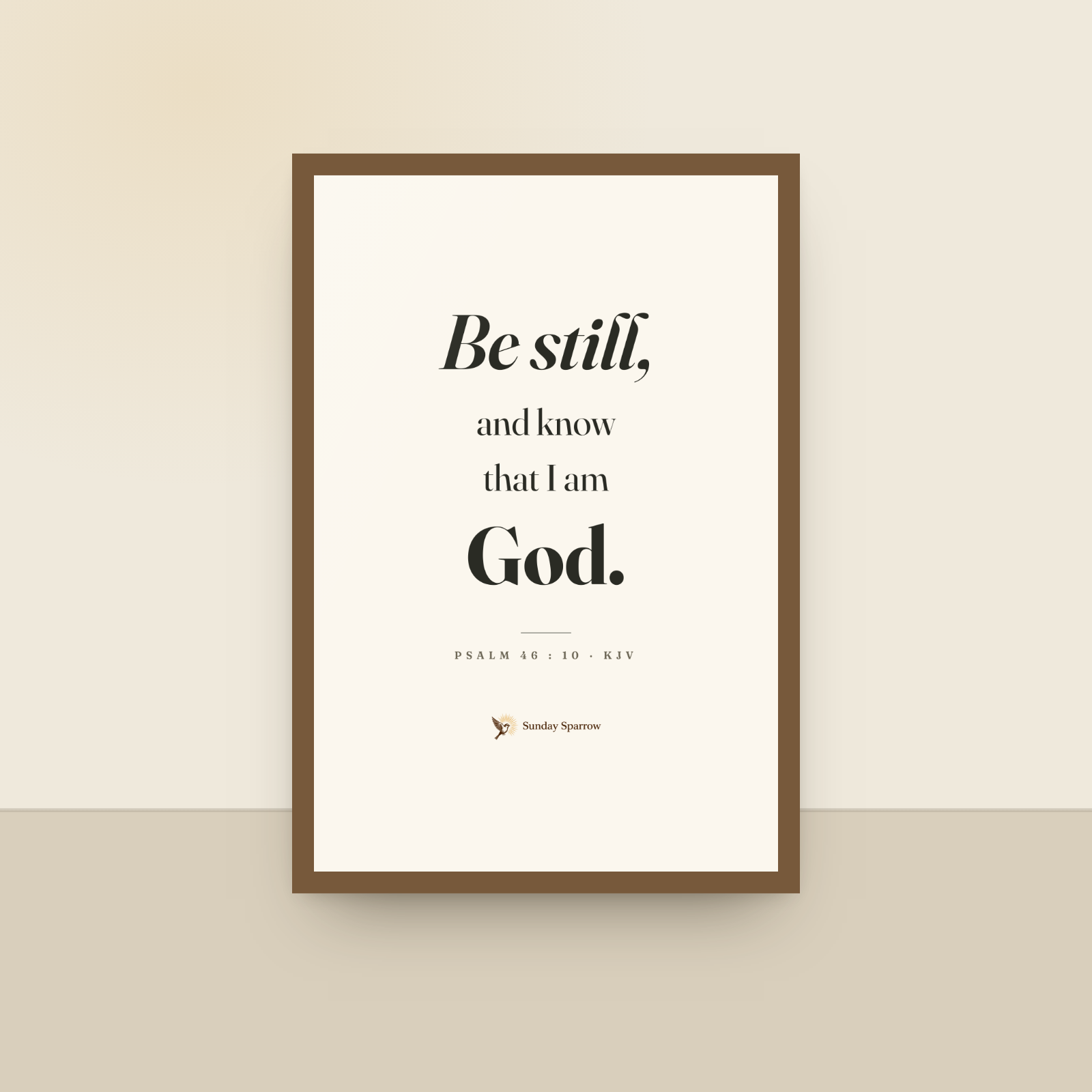 Be Still (Psalm 46:10) — King James scripture art print in a oak finish wood frame, hanging on a wall